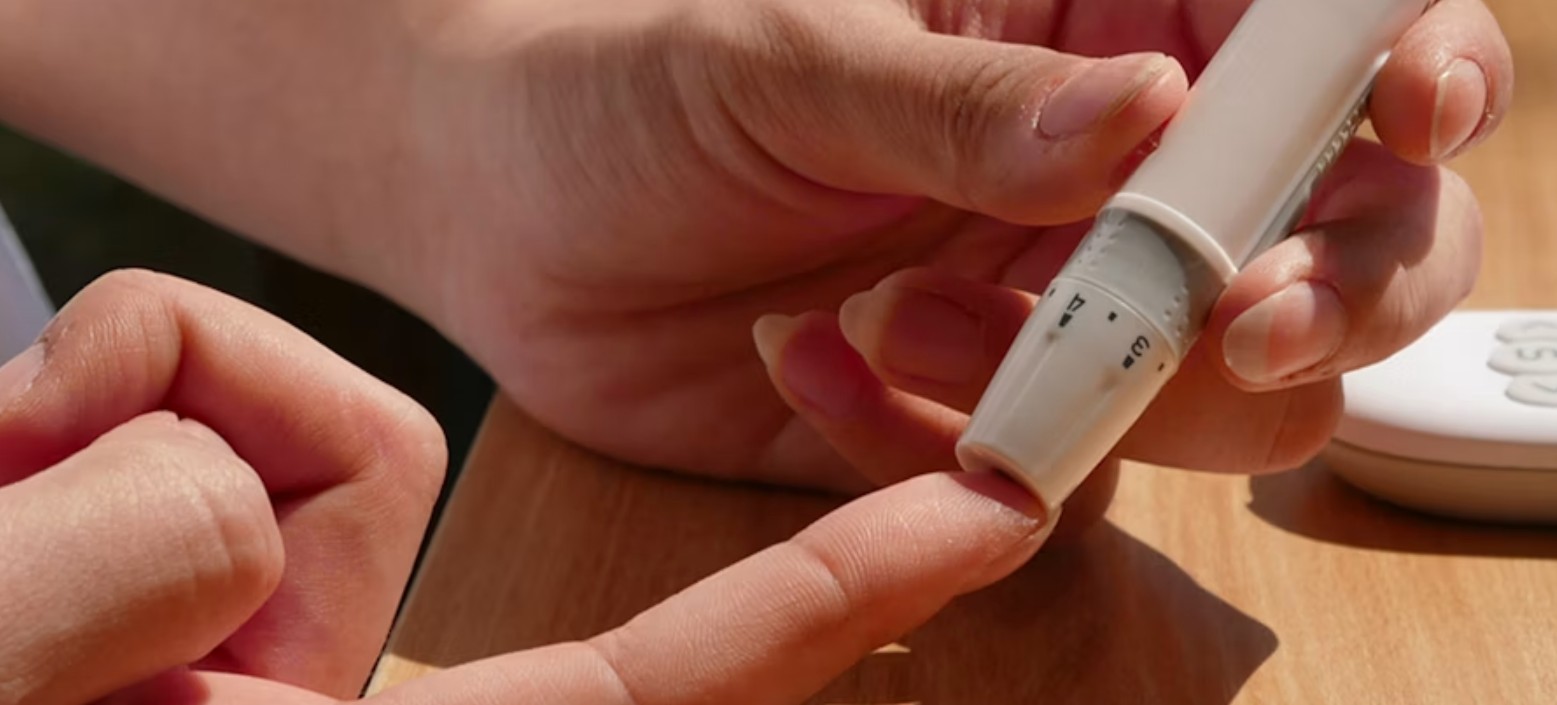 Close-up of a finger-prick blood sugar test