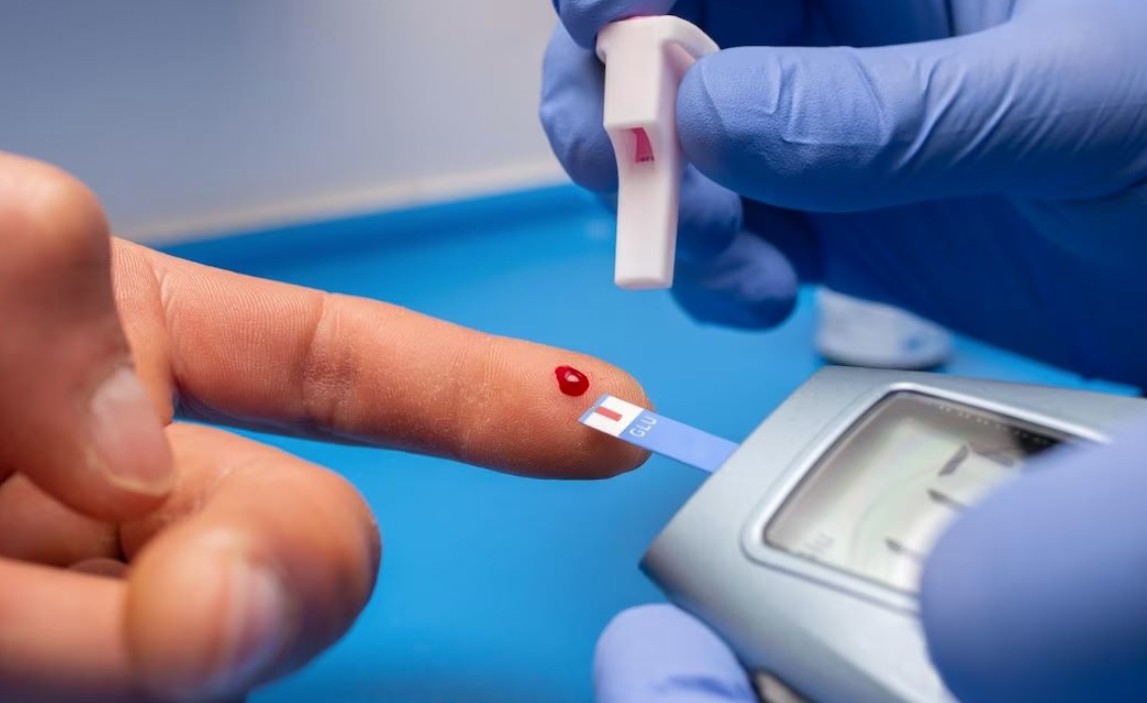 Person checking blood sugar levels with a glucose meter